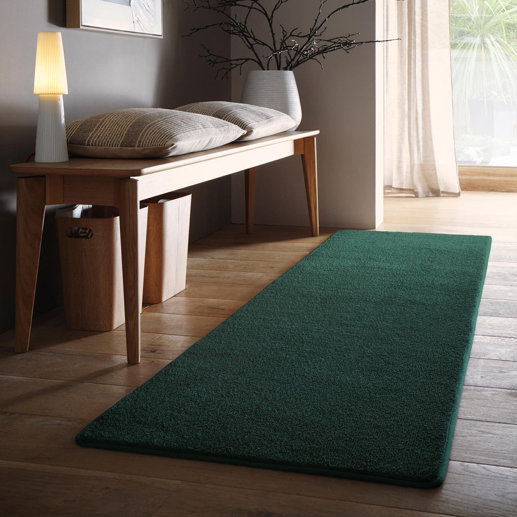 Sense Forest Green Washable Rug Runner- a 100% recycled polyester rug runner in a solid green colour.