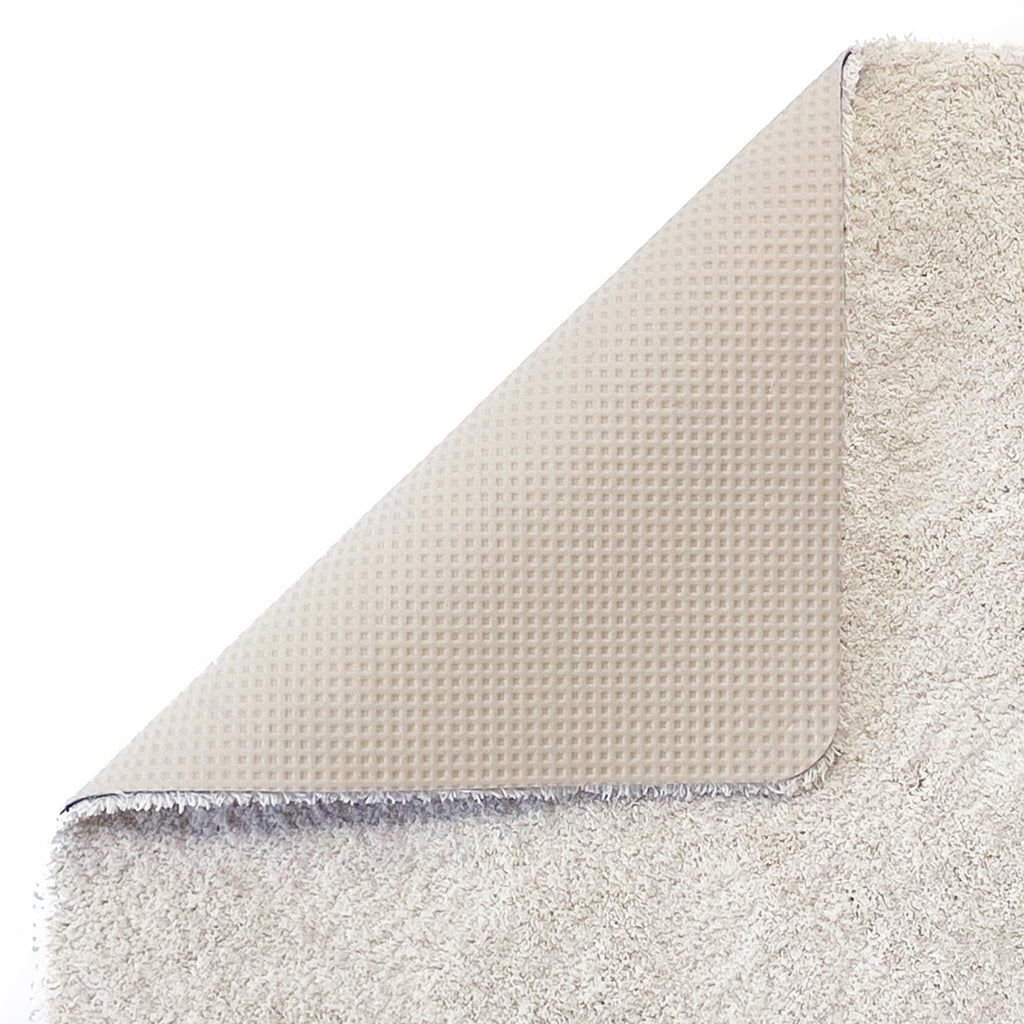Sense Pumice Stone Bath Mat- a bath mat made from recycled materials in a solid cream.