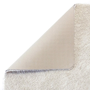 Sense Pumice Stone Bath Mat- a bath mat made from recycled materials in a solid cream.
