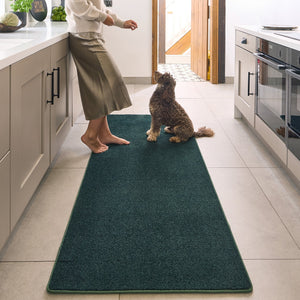 Sense Forest Green Washable Rug Runner- a 100% recycled polyester rug runner in a solid green colour.