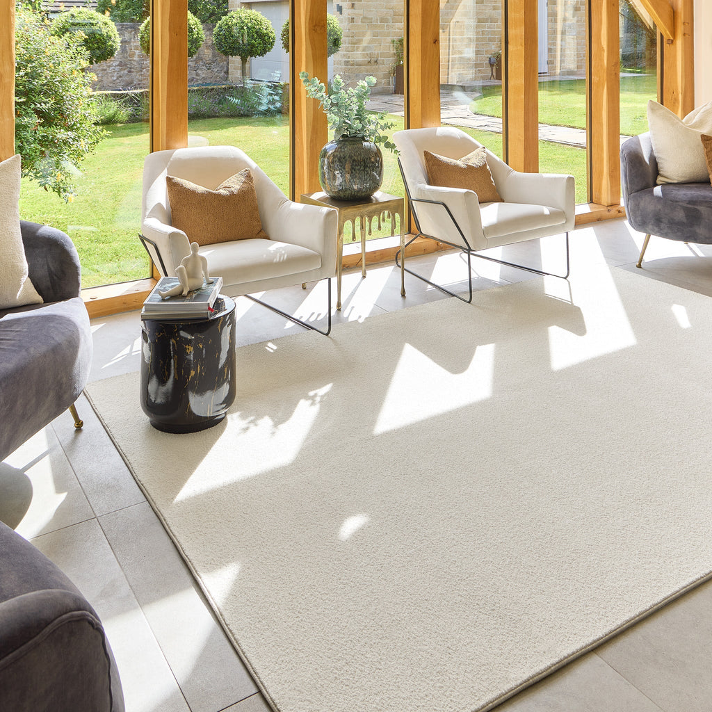 Sense Pumice Stone Washable Rug- a 100% recycled polyester rug in a solid cream colour.