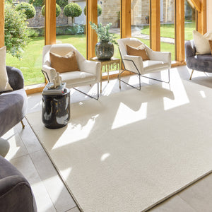Sense Pumice Stone Washable Rug- a 100% recycled polyester rug in a solid cream colour.
