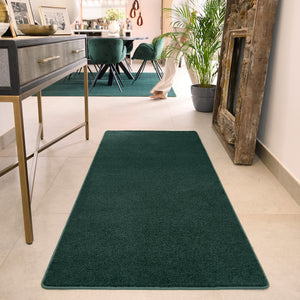 Sense Forest Green Washable Rug Runner- a 100% recycled polyester rug runner in a solid green colour.