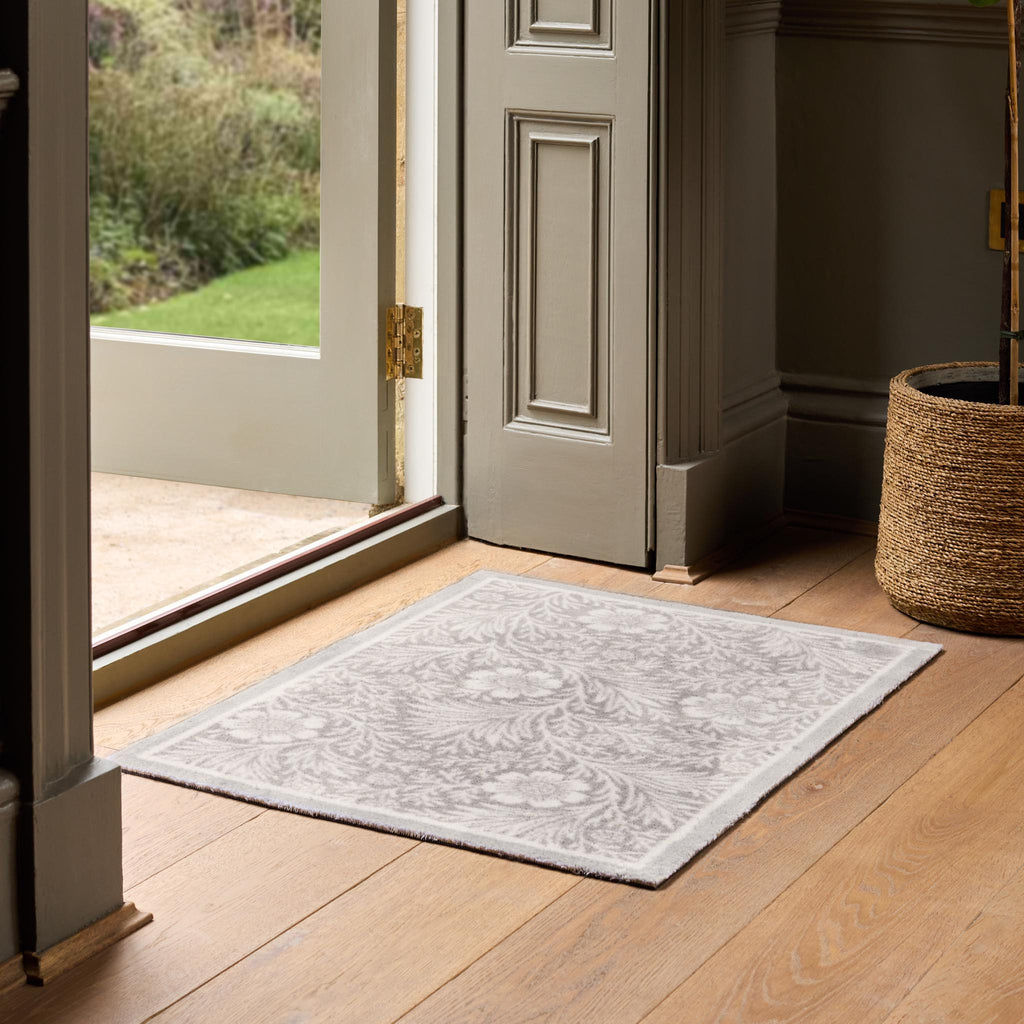Soft Floral Washable Doormat- a cotton doormat featuring an elegant white floral pattern.