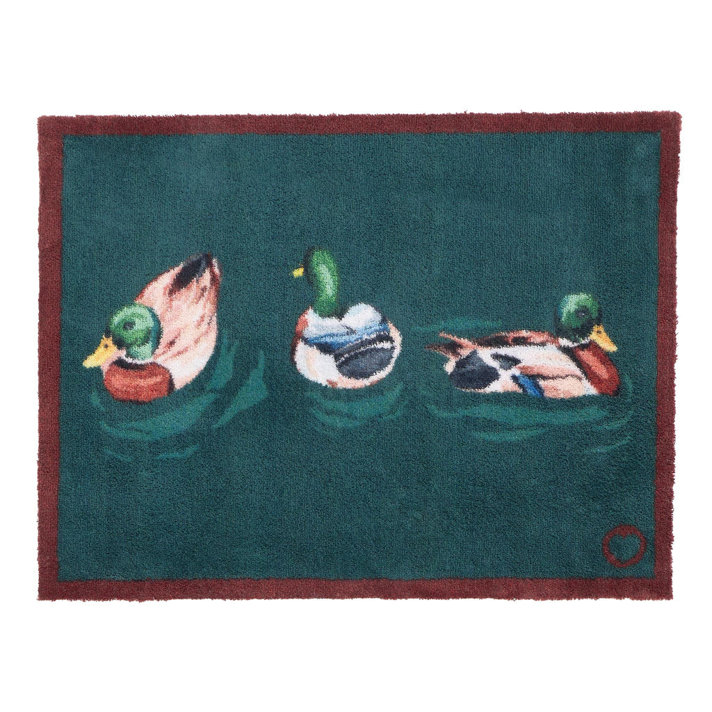 Swimming Ducks Teal Doormat – a teal cotton doormat featuring three swimming ducks.