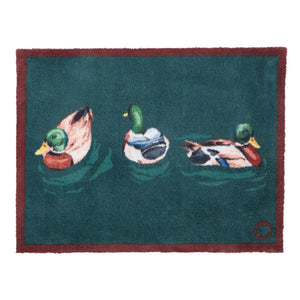 Swimming Ducks Teal Doormat – a teal cotton doormat featuring three swimming ducks.