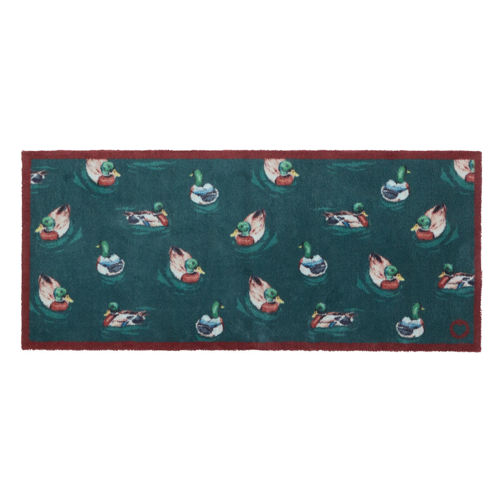Swimming Ducks Teal Washable Runner- a 100% recycled cotton runner featuring multiple ducks swimming and creating ripples in the water.