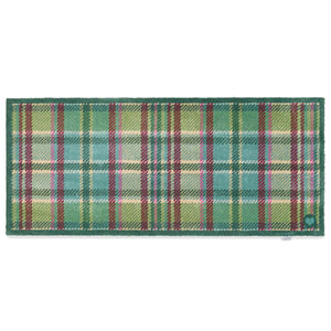 Tartan Green Washable Runner in Green- a 100% recycled cotton runner featuring a traditional tartan design in shades of green with hints of pink, burgundy, and beige.