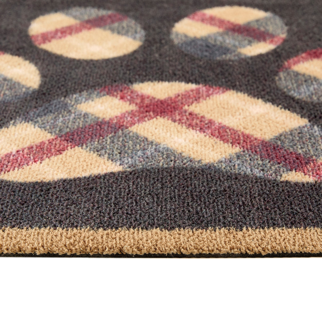 Close up of Hug Rug black tartan paw washable doormat pattern and texture