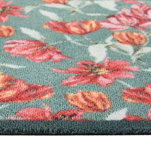 Tumbling Tulips Washable Runner- a 100% recycled cotton runner featuring tulips in rich reds, pinks and oranges, scattered across a soft teal backdrop.