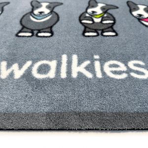 Close up image of the walkies text and sheepdog pattern on the grey Herdy washable doormat from Hug Rug