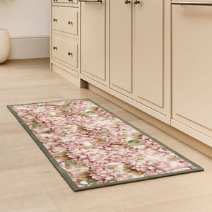 Wild Hydrangea Washable Runner- a 100% recycled cotton runner featuring hydrangea blooms in rust and soft pinks, accented with green and olive leaves.