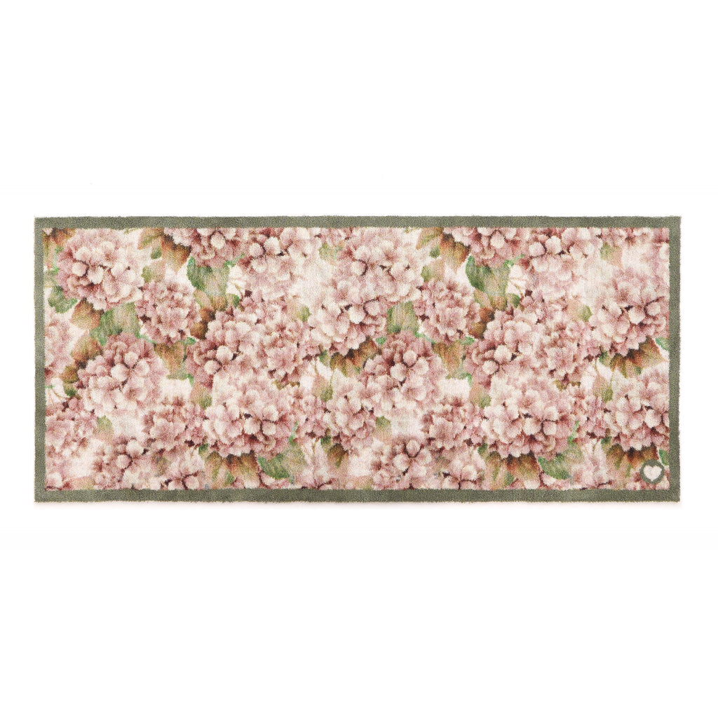 Wild Hydrangea Washable Runner- a 100% recycled cotton runner featuring hydrangea blooms in rust and soft pinks, accented with green and olive leaves.