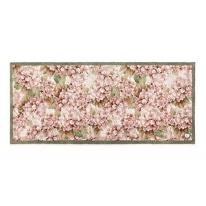 Wild Hydrangea Washable Runner- a 100% recycled cotton runner featuring hydrangea blooms in rust and soft pinks, accented with green and olive leaves.