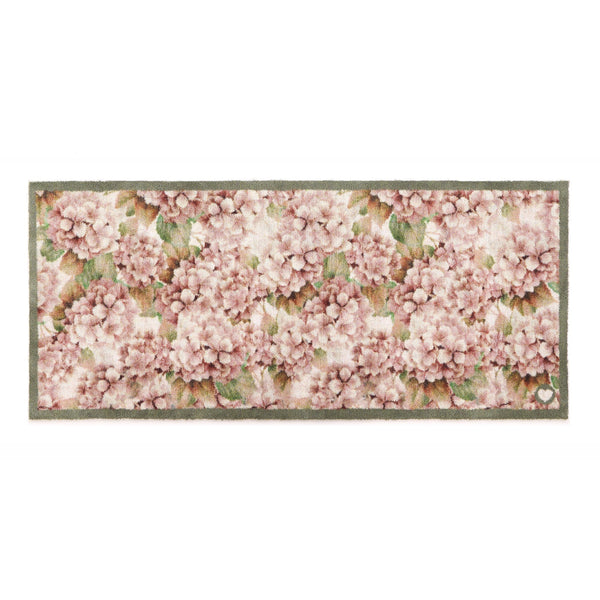 Wild Hydrangea Washable Runner- a 100% recycled cotton runner featuring hydrangea blooms in rust and soft pinks, accented with green and olive leaves.