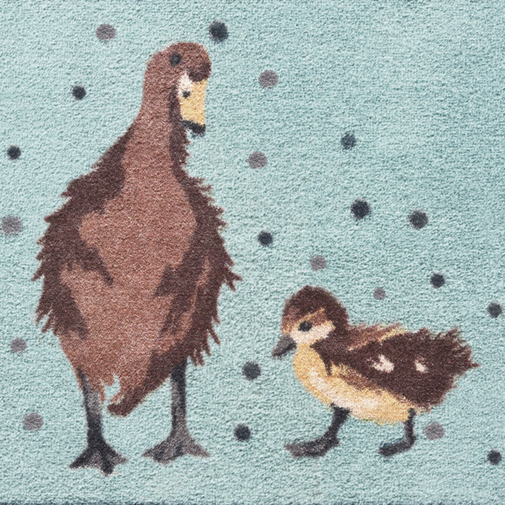 Ducks 1 Blue Washable Runner in Blue- a 100% recycled cotton runner featuring a brown duck with two ducklings surrounded by grey and blue spots.