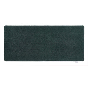 Sense Forest Green Washable Runner- a 100% recycled polyester runner in a solid green.