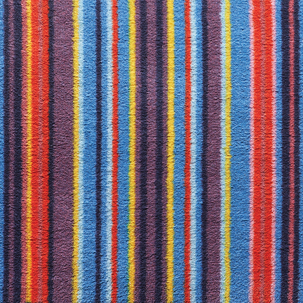 Stripe 85 Multi Washable Runner- a 100% recycled cotton runner featuring vertical stripes in yellow, blue, pink, red, purple, and navy.