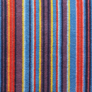 Stripe 85 Multi Washable Runner- a 100% recycled cotton runner featuring vertical stripes in yellow, blue, pink, red, purple, and navy.