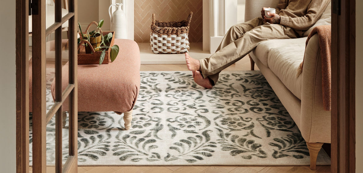Vintage Scroll Green Eco-Washable Rug, styled in a living room.