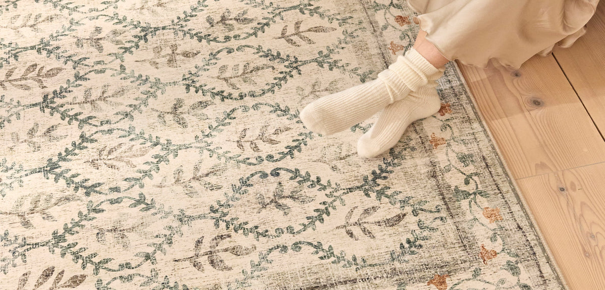 English Garden Eco-Washable Rug, styled on wooden flooring.