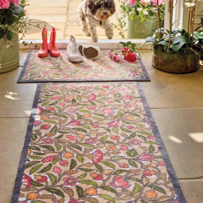May Floral Washable Runner in Beige- a 100% recycled cotton runner featuring hand-painted orange, pink, and burgundy flowers. 