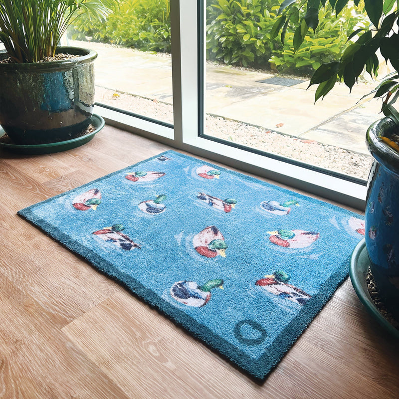 Swimming Ducks Washable Doormat made from 100% recycled cotton, featuring swimming ducks.