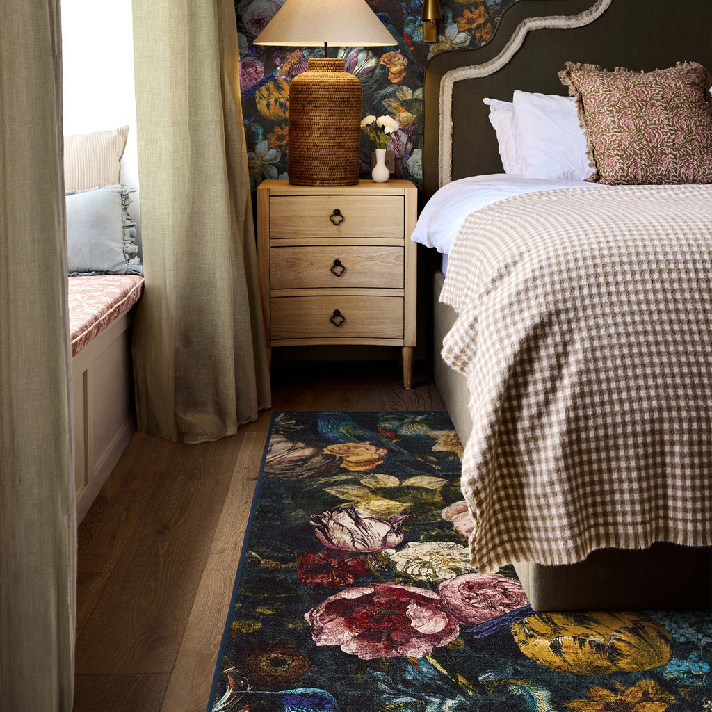 Allure Eco-Washable Rug with a floral design, styled in a bedroom.