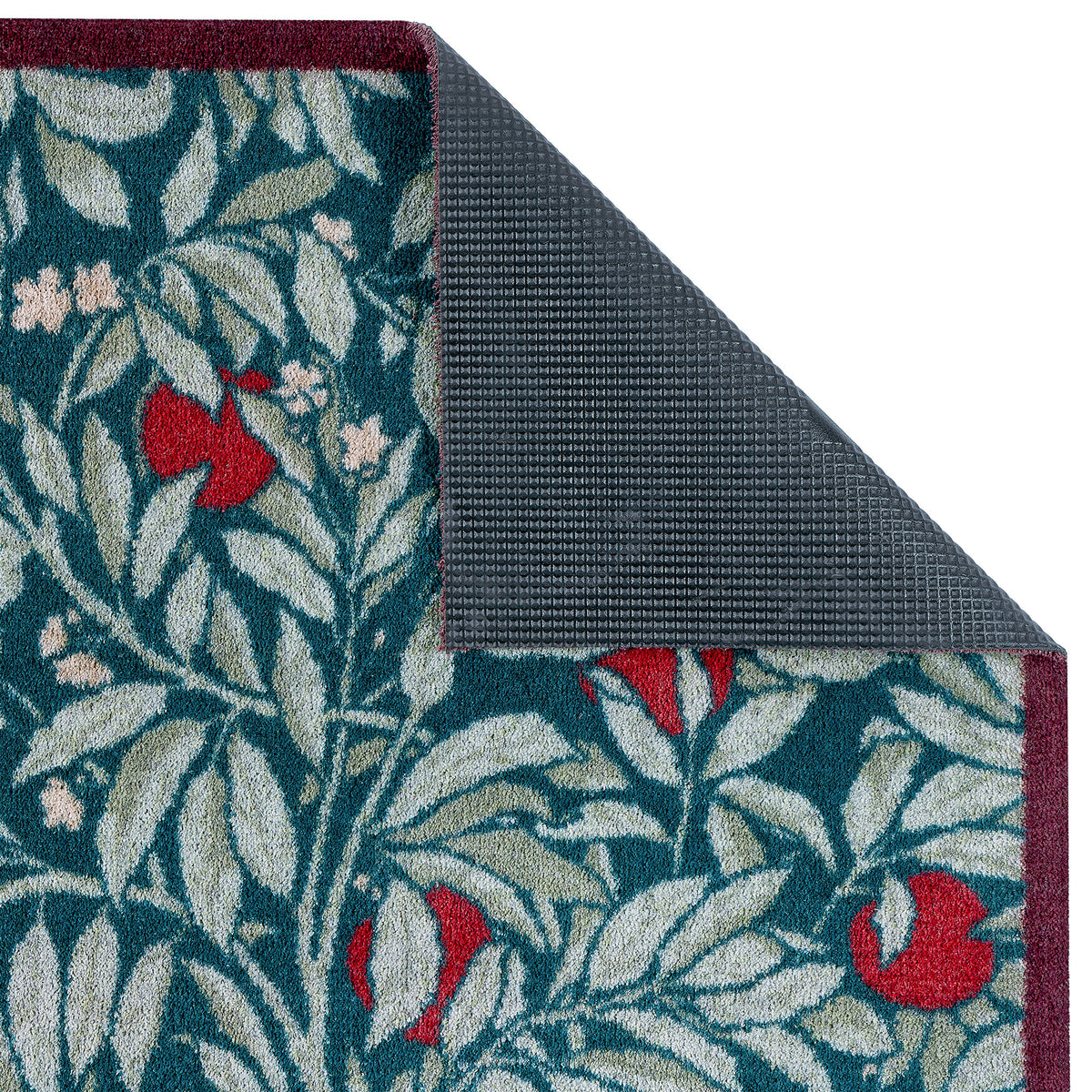 Close-up of Ancient Apple Tree Midnight Washable Doormat with an apple tree design showing the rubber backing.
