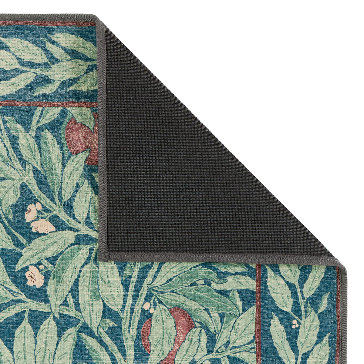 Ancient Apple Tree Midnight Eco-Washable with a red apple tree design showing the rubber backing. 