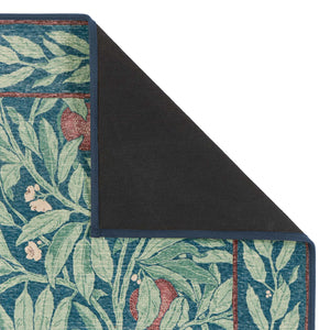 Close-up of Ancient Apple Tree Midnight Eco-Washable Rug with apple tree design showing rubber backing.