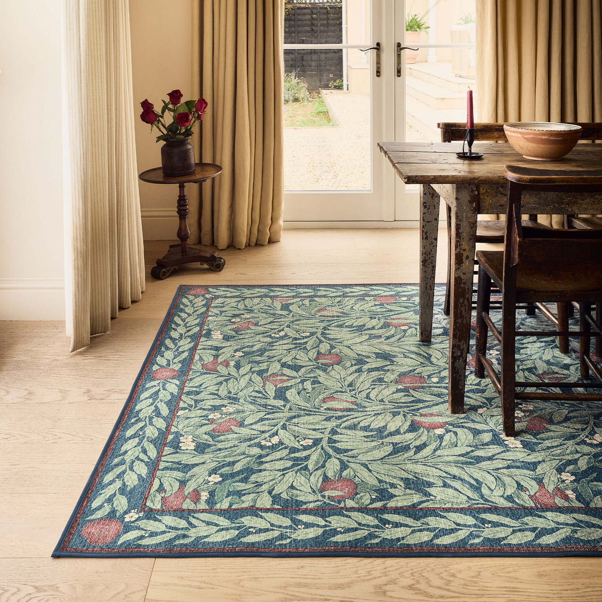 Ancient Apple Tree Midnight Eco-Washable Rug with an apple tree design, styled on wooden flooring. 