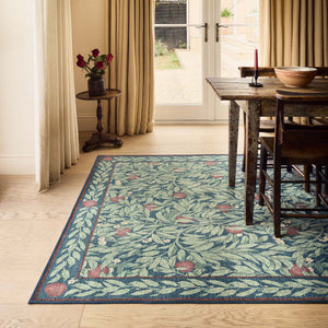 Ancient Apple Tree Midnight Eco-Washable Rug with an apple tree design, styled on wooden flooring. 