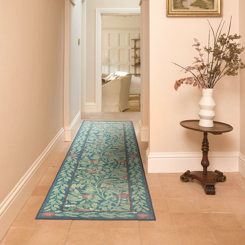 Ancient Apple Tree Midnight Eco-Washable Runner with an apple tree design, styled on tiled flooring.