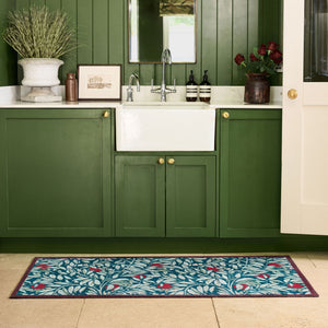 Ancient Apple Tree Midnight Washable Runner with an apple tree design, styled by a sink. 