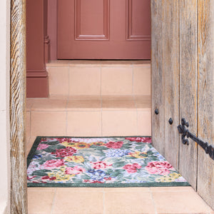 Antique Hydrangea & Rose Chintz Washable Doormat with a floral design, styled on tiled flooring.