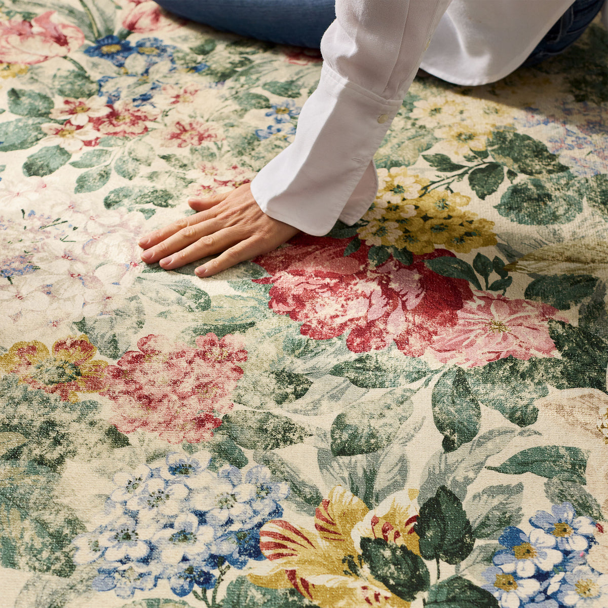 Close-up of Antique Hydrangea & Rose Chintz Eco-Washable Rug with a floral design.