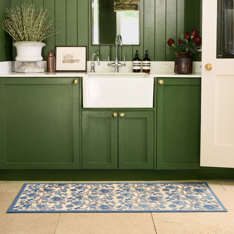 Azalea Walk Wedgwood Washable Runner with a blue floral pattern, styled by the sink.