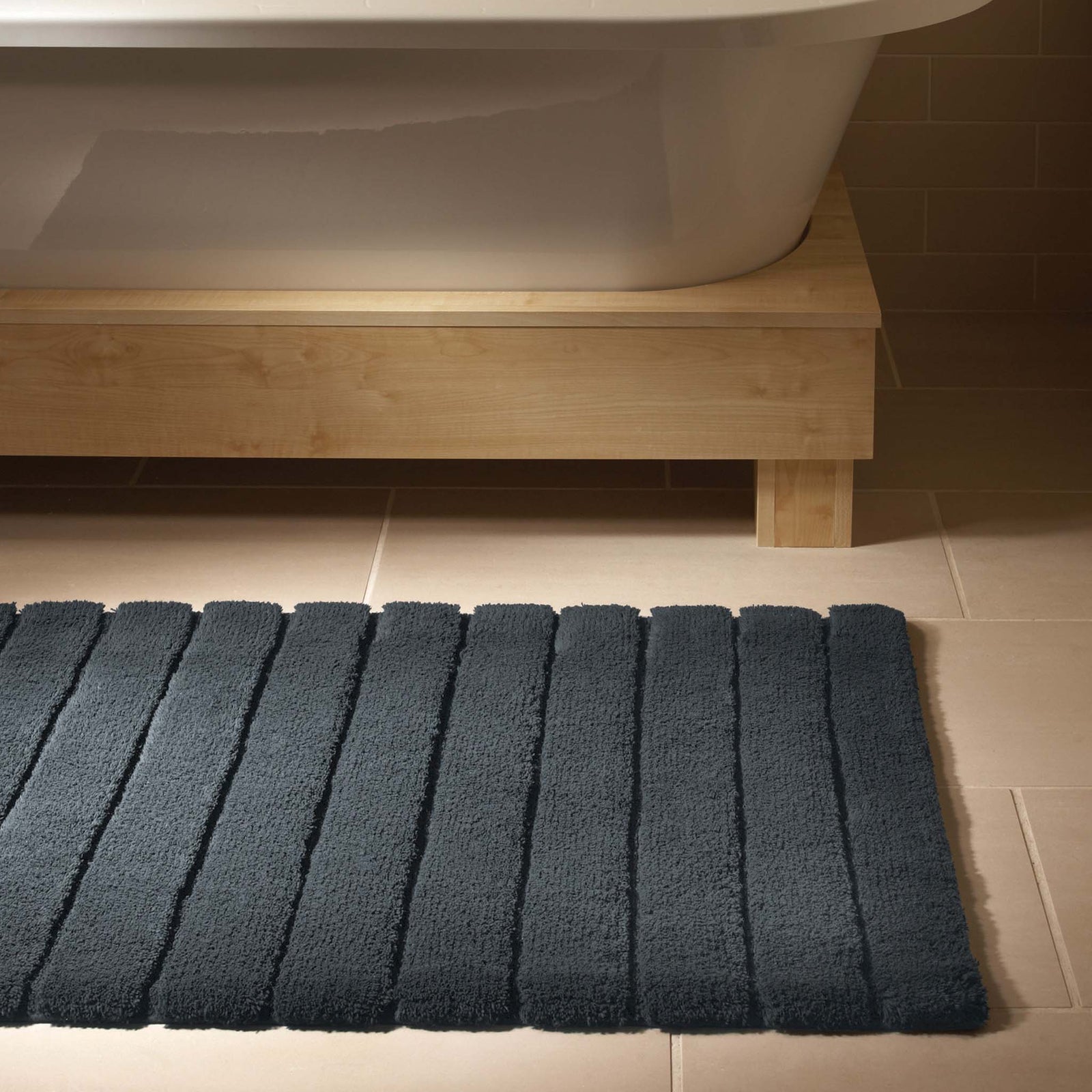 Bamboo Graphite Stripe Bath Mat - 100% bamboo bath mat featuring a dark grey carved stripe pattern.