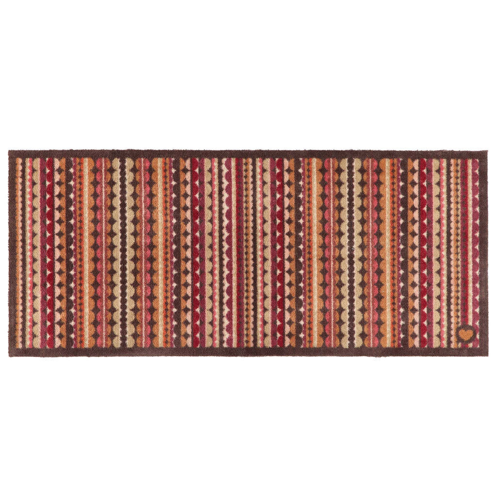 A rectangular woven runner with a Southwestern-style geometric pattern featuring vertical stripes of red, orange, beige, and brown with diamond and triangle motifs, set against a plain white background.