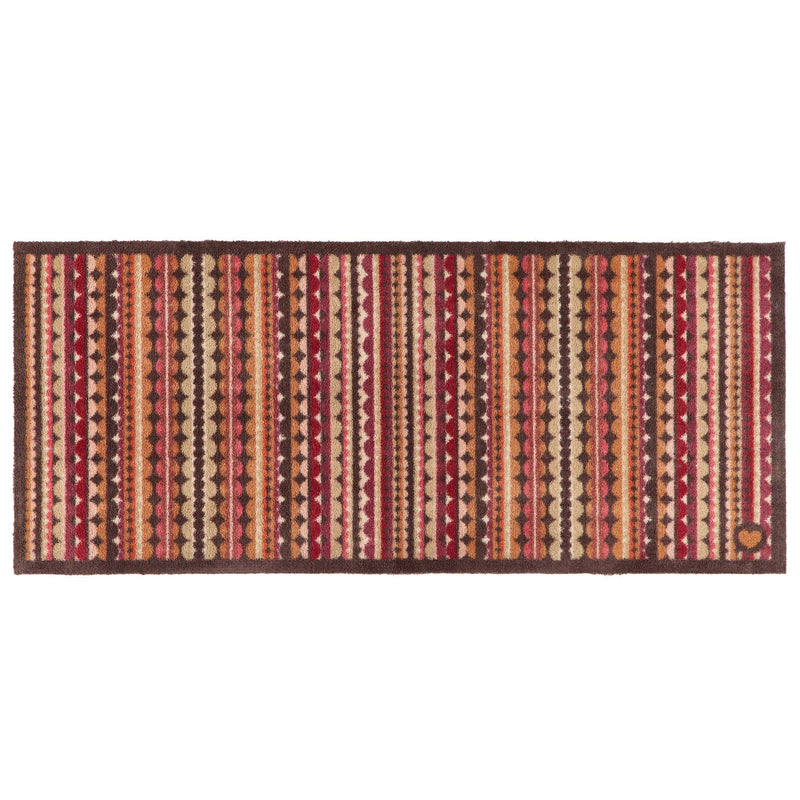 A rectangular woven runner with a Southwestern-style geometric pattern featuring vertical stripes of red, orange, beige, and brown with diamond and triangle motifs, set against a plain white background.