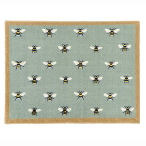 A rectangular doormat with a sage green background featuring a repeating pattern of bumblebees, finished with a natural coloured border.