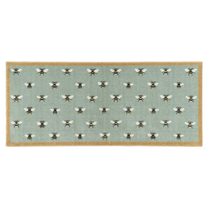 A rectangular area runner with a light sage green background featuring a repeating pattern of bumblebees, finished with a natural colour border.
