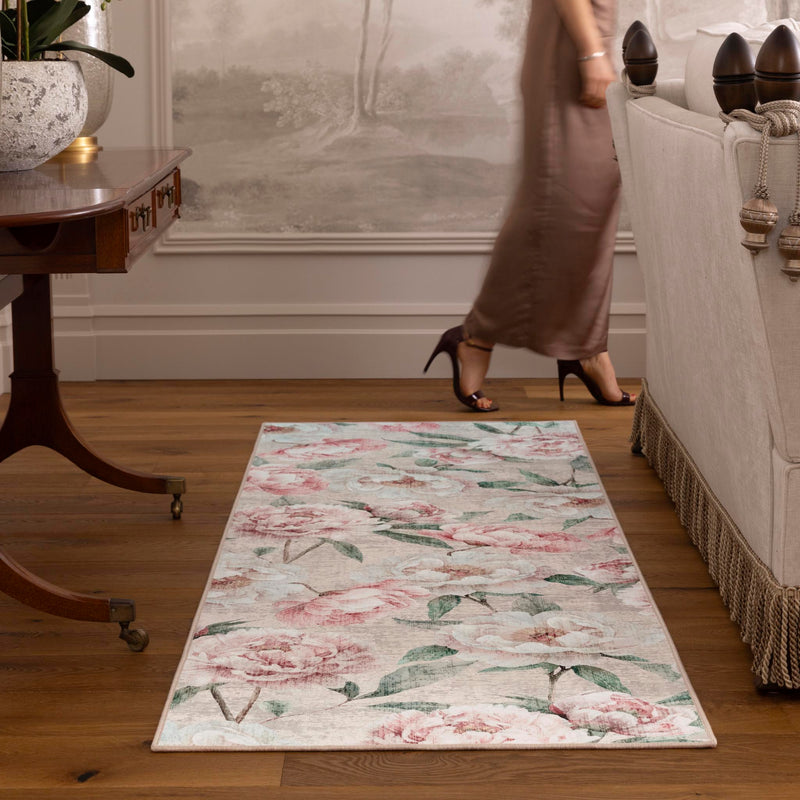 Blooming Peonies Pink Eco-Washable Runner with an floral bloom design, styled by the sofa.