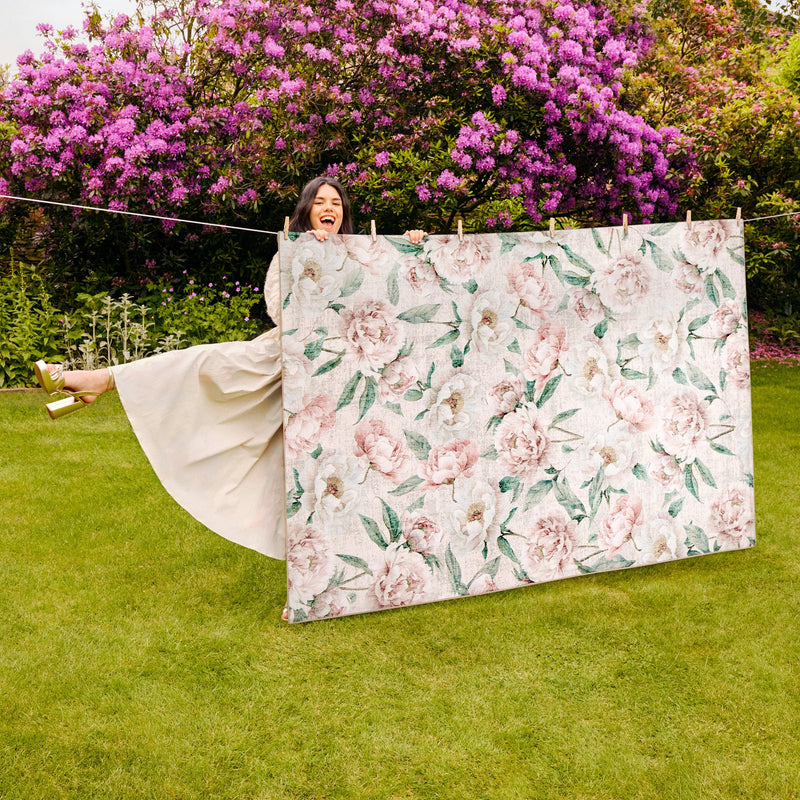 Blooming Peonies Pink Eco-Washable Rug made from 100% recycled materials, featuring pink peonies against a pink background.
