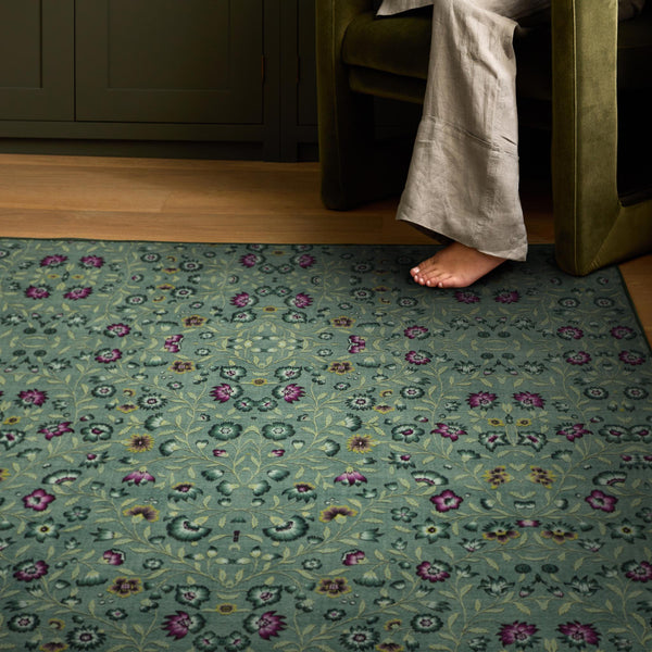 Blossoming Vines Eco-Washable Rug- a green eco-washable rug featuring colourful florals and green leaves. 