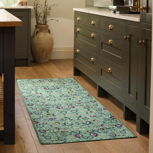 Blossoming Vines Eco-Washable Rug- a green eco-washable rug featuring colourful florals and green leaves. 