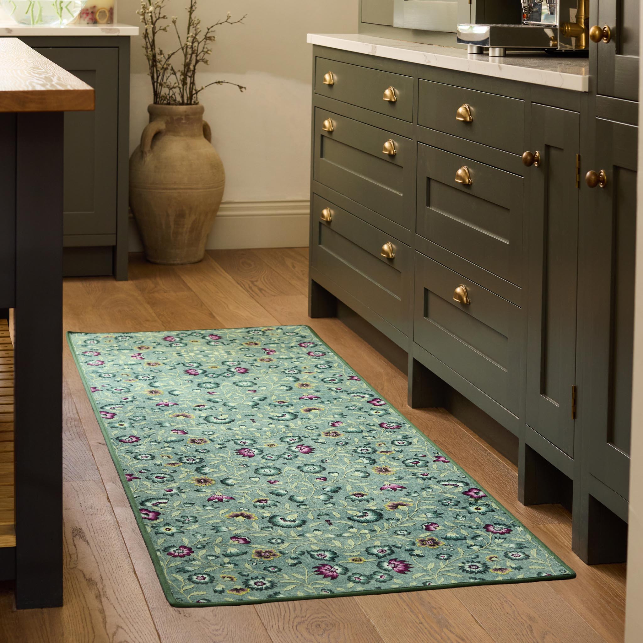 Blossoming Vines Eco-Washable Rug- a green eco-washable rug featuring colourful florals and green leaves. 