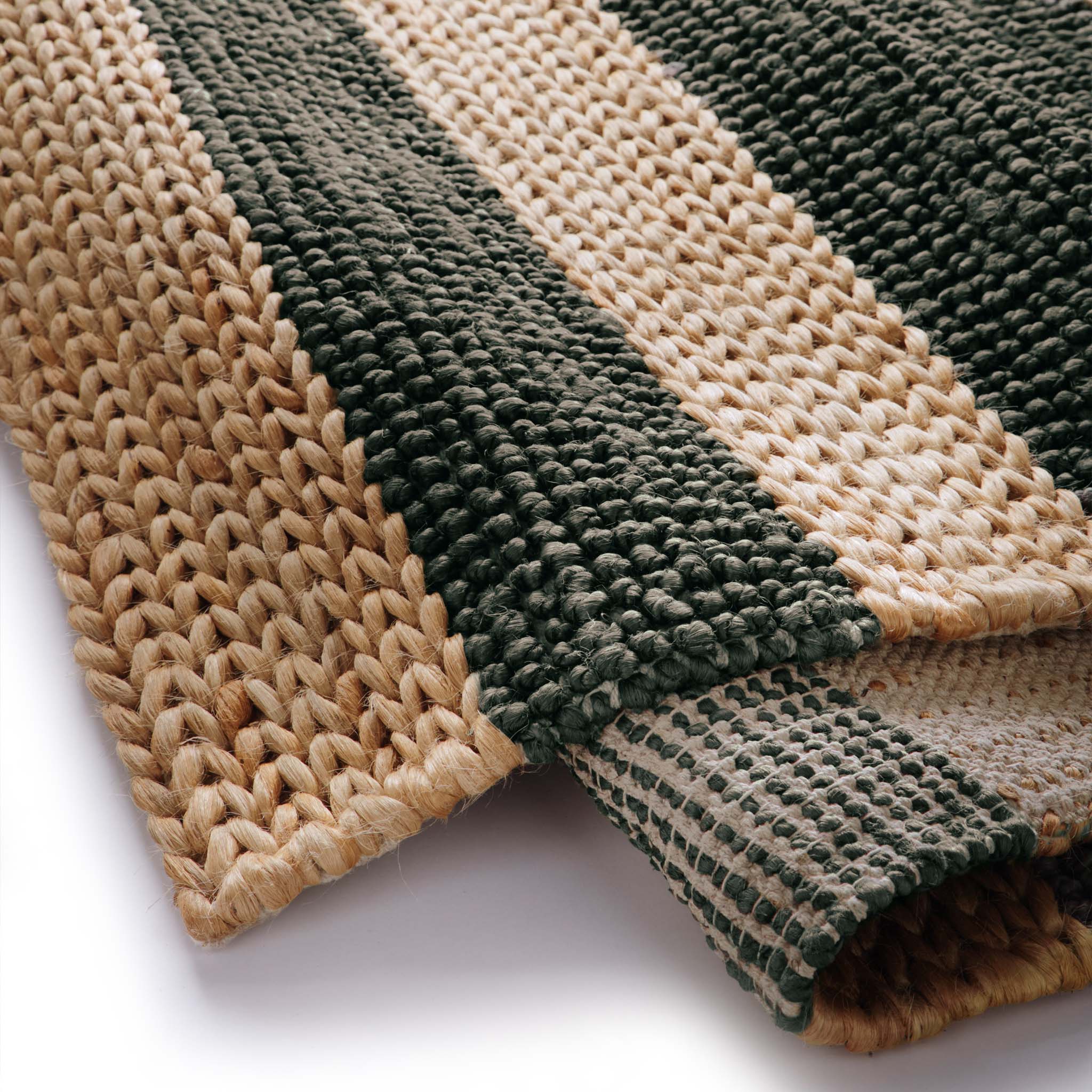 Close-up of Bondi Jute Stripe Natural/Bottle Green Rug with a green stripe design.