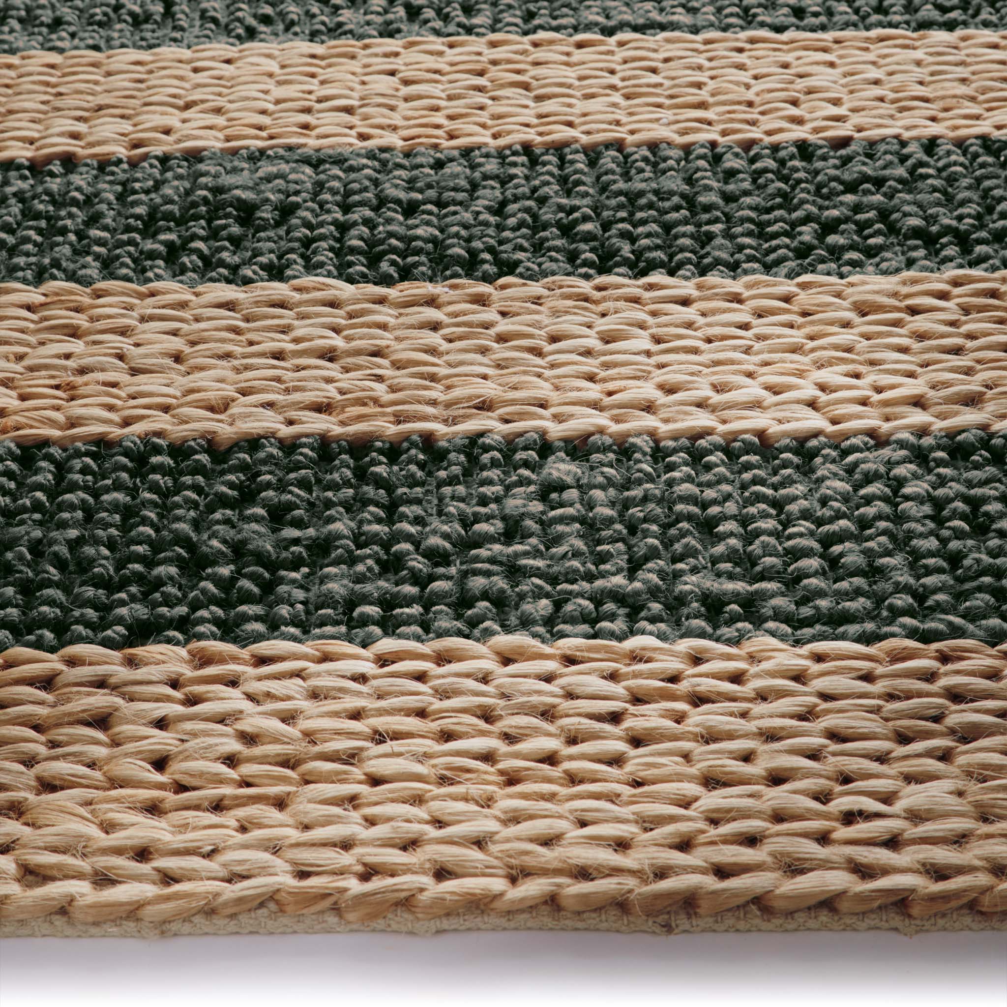 Close-up of Bondi Jute Stripe Natural/Bottle Green Rug with a green stripe design.